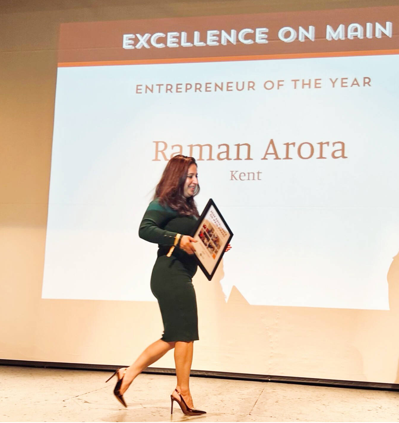 Raman Arora, the owner of Maggies on Meeker restaurant, accepting her Entrepreneur of the Year Award in Walla Walla. COURTESY PHOTO, Kent Downtown Partnership