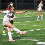 Lauren Tripp kicks the ball up-field for the Falcons. Ben Ray / The Reporter