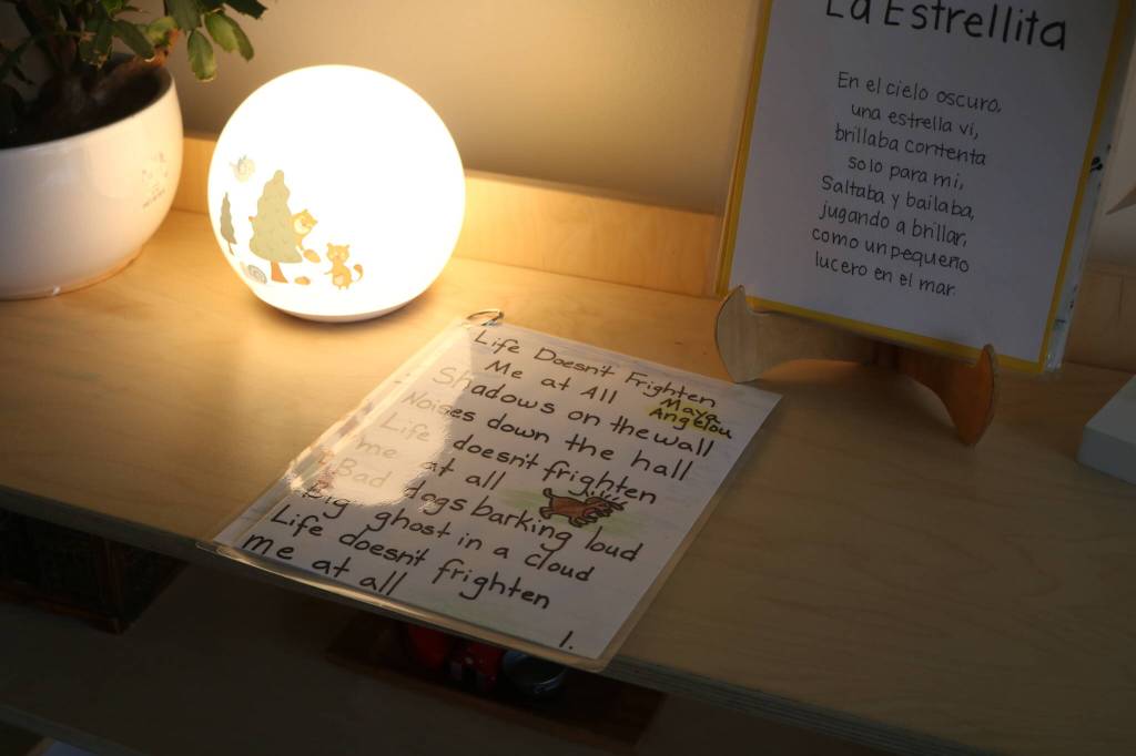 Bezos students can learn early writing skills by tracing the letters in this laminated Maya Angelous poem. Photo by Bailey Jo Josie/Sound Publishing.