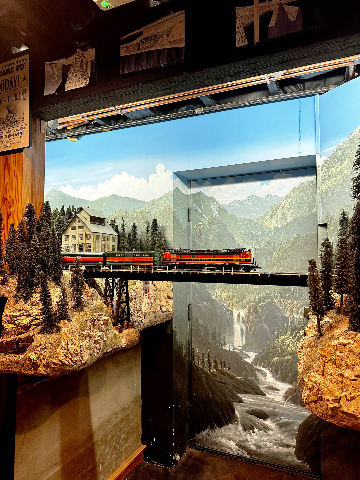 A model train crosses a bridge in front of the exterior door to Peter Hamblings basement. The basement was built for this project. GRACE GORENFLO, Sound Publishing
