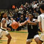 Kentwood senior Corey Tita makes a pass against Auburn. Ben Ray / The Reporter