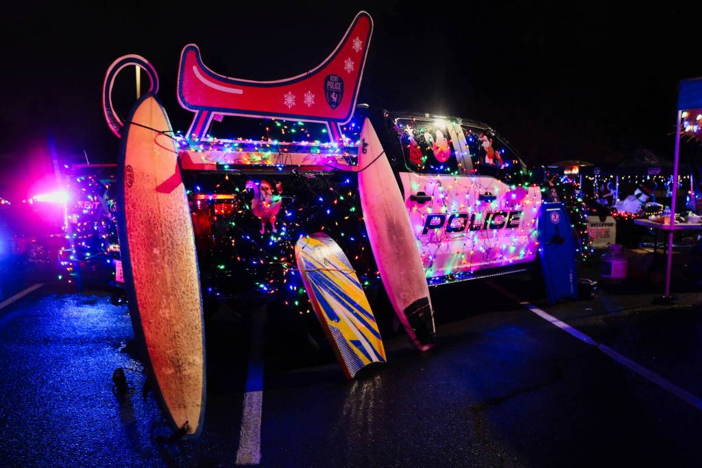 The Kent Police Department even waxed their surf boards for their holiday display. Photo by Bailey Jo Josie/Sound Publishing.