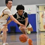 Mason St. Louis battles for a loose ball. Ben Ray / The Reporter