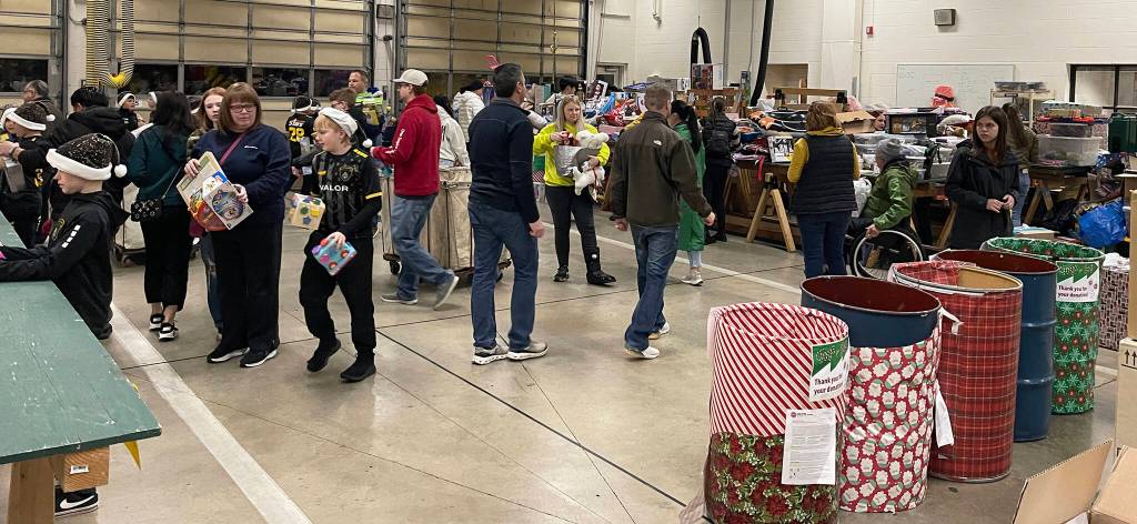 Volunteers help wrap and sort toys. COURTESY PHOTO, Puget Sound Fire