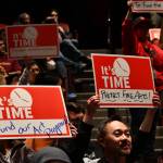 Attendees display their signs at the School Funding Crisis Eastside Town Hall on Jan. 8 at Sammamish High School in Bellevue. Andy Nystrom/ staff photo