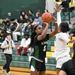Kentwoods Jessica Ajayi takes a three-pointer against Kentridge. Ben Ray / The Reporter