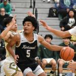 Kentwoods Mason St. Louis drives to the basket. Ben Ray / The Reporter