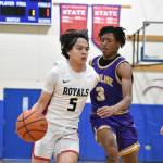 Sophomore Raymond Wong fights off a Highline defender for the Royals. Ben Ray / The Reporter