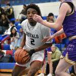 Kent-Meridian senior Christian Mortimer drives to the basket. Ben Ray / The Reporter