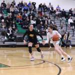Kentwoods Tyanna Sims looks to use her size and speed to sprint past a Tahoma defender at the top of the key. Tyler Rubenstein/ For The Reporter