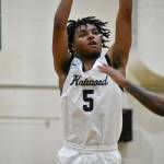 Mason St. Louis takes a three point shot. Ben Ray / The Reporter