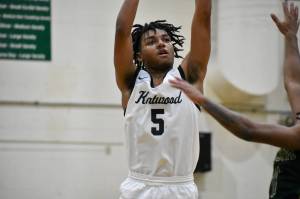 Kentwoods Mason St. Louis takes a three point shot. Ben Ray / The Reporter