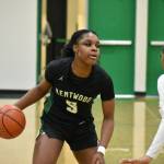 Jessica Ajayi dribbles the basketball for Kentwood against Kentridge. Ben Ray / The Reporter