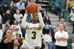 Jaya Brown goes up for a lay-up against Kentwood. Ben Ray / The Reporter