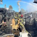 Firefighters look for hot spots during a Feb. 6 response to a mobile home fire that displaced seven people. COURTESY PHOTO, Puget Sound Fire