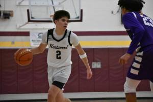 Brandon Tagle dribbling the basketball against Sumner. Ben Ray / The Reporter