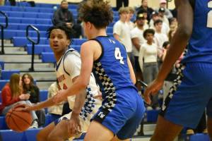 Auburn Mountainview senior Sebastian Arius backs down a Federal Way player. Ben Ray / The Reporter