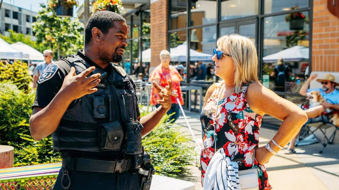 Toni Troutner talks with a Kent Police officer. COURTESY PHOTO, Toni Troutner