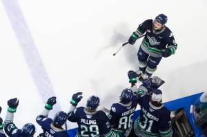 Brayden Schuurman skates down the bench after scoring a goal against the Tri-City Americans. COURTESY PHOTO, Brian Liesse, Seattle Thunderbirds