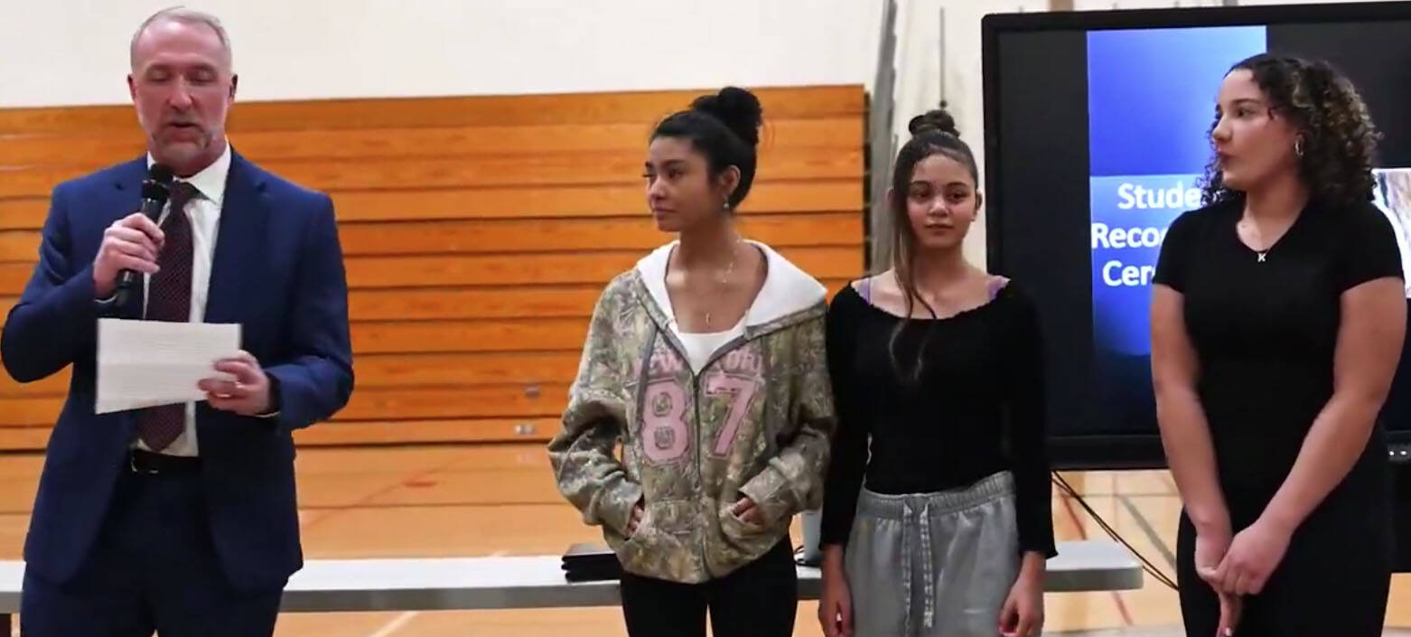 Steve Vienneau, a Seattle FBI supervisory special agent, prepares to give out certificates to three girls who helped stopped the abduction of a 6-year-old girl in July 2024 at a Kent apartment complex. SCREENSHOT/FBI video