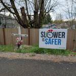 The Coury family placed their Slower is safer yard sign near the roadside memorial dedicated to their son, Gabriel, who was hit by a speeding drunk driver in 2023. Photo courtesy of Shellie Coury