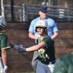 Genesis Miller high fives Jozi Thompson. Ben Ray / The Reporter