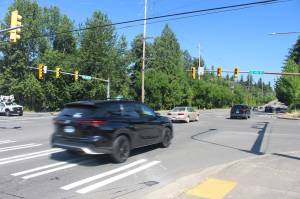 Cars drive northbound through the intersection of Southeast 192nd Street and 140th Avenue Southeast in Fairwood. An 18-year-old was driving over 100 mph southbound through this intersection on March 19, 2024 when his car hit a minivan, resulting in the deaths of one woman and three minors. Photo by Bailey Jo Josie/Sound Publishing.
