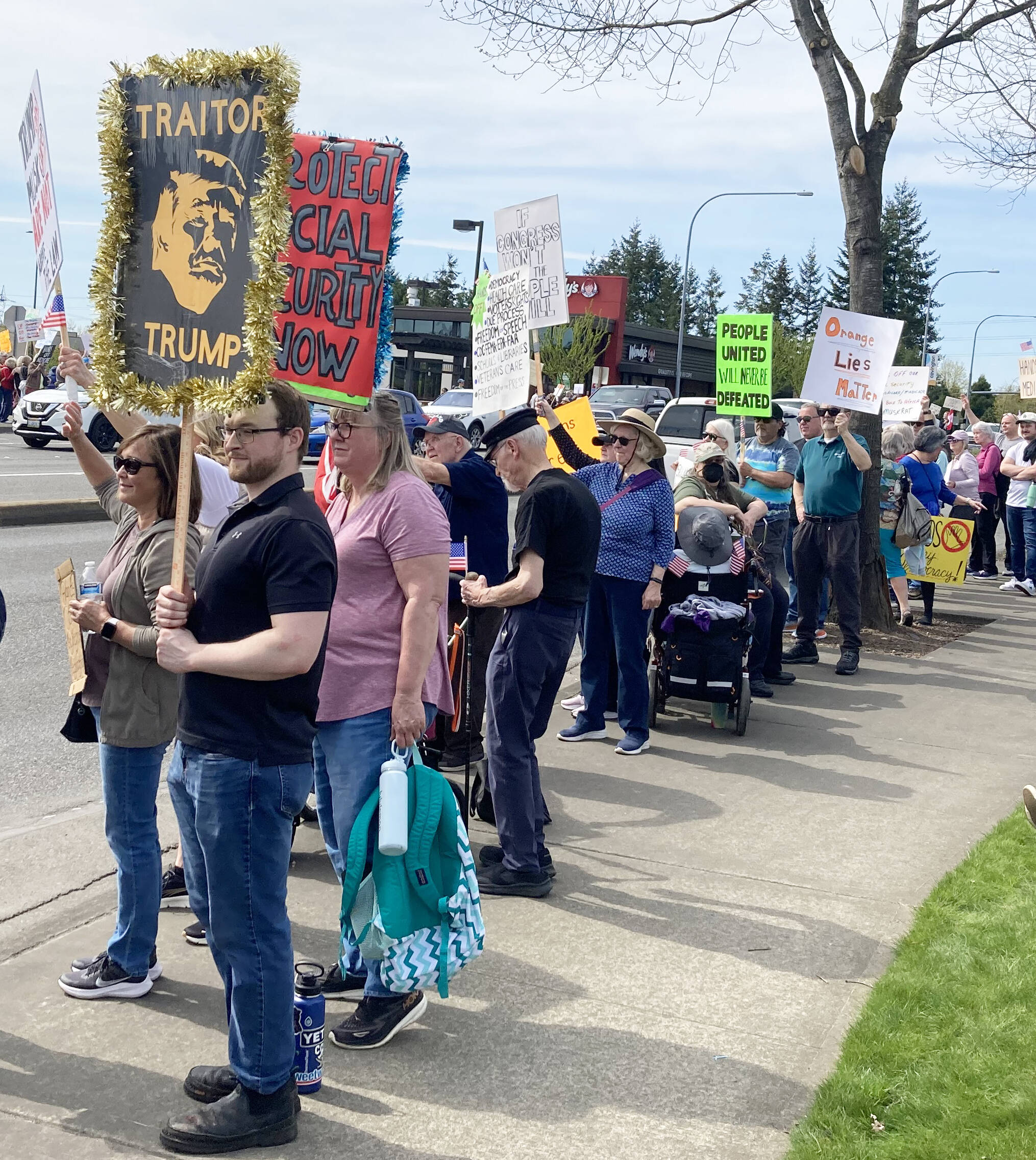 Protesters line SE 272nd Street on April 5 in Covington. COURTESY PHOTO, Ron Auerbach
