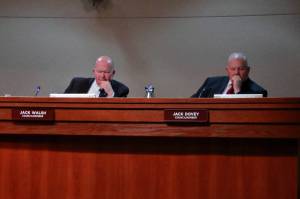 Councilmembers Jack Walsh and Jack Dovey consider the resolution to support Emerald City Behavioral Health, ultimately voting no. Photo by Keelin Everly-Lang / Sound Publishing