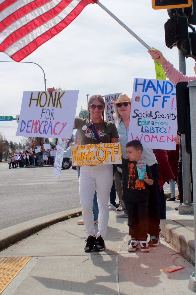 Three generations came out together to share their concerns about the current presidential administrations actions at the Hands Off demonstration on April 5. Photo by Keelin Everly-Lang / Sound Publishing