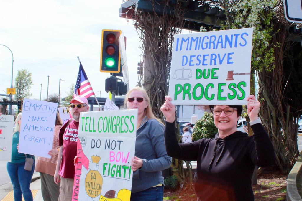 American flags and signs were everywhere during the Hands Off demonstration on April 5 in Federal Way. Photo by Keelin Everly-Lang / Sound Publishing