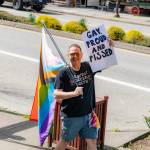 SnoValley Pride founder Gregory Jamiel holds up his gay, proud and pissed sign during Duvalls Hands Off! protest April 5, 2025. Photo courtesy of Travis Wetherbee/Last Lite Photography