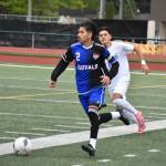 Christian Gomez San Juan controls the ball moving upfield for Kent-Meridian. Ben Ray / The Reporter