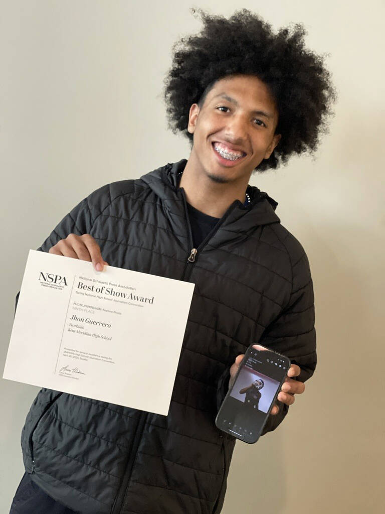 John Sanchez displays his award and winning photo. COURTESY PHOTO, Kent School District