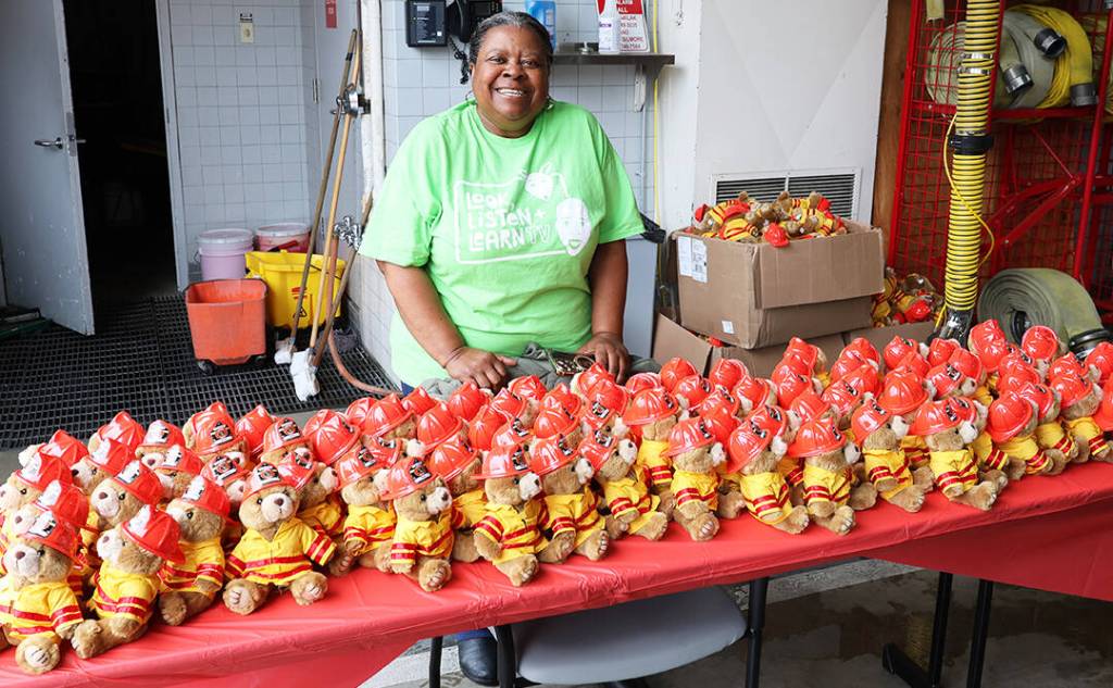 Kent City Councilmember Brenda Fincher prepares to hand out free teddy bears. COURTESY PHOTO, Puget Sound Fire