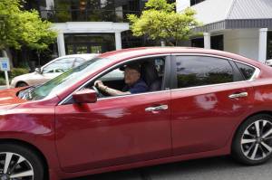 Henry Lazzar driving his car. Photo by Joshua Solorzano/Sound Publishing