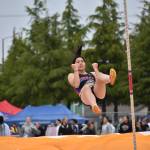 Candice Le celebrates making it over the bar in the Pole Vault for Kent-Meridian. Ben Ray / The Reporter