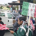 A woman protests along with about 1,500 others during a No Kings event Saturday, June 14 in Covington. STEVE HUNTER, Kent Reporter