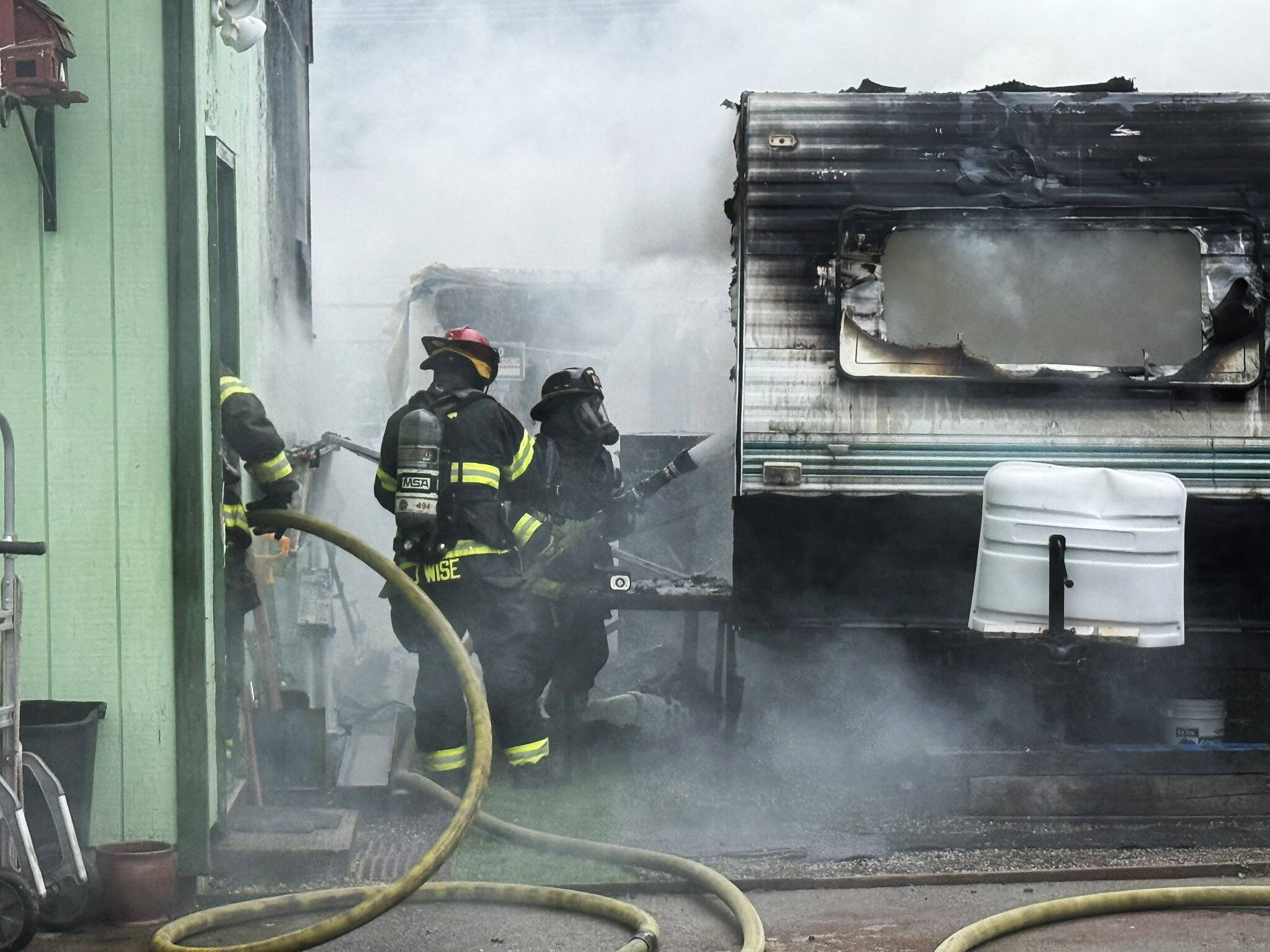 Puget Sound Fire firefighters battle a camper fire June 12 along First Avenue South in downtown Kent. COURTESY PHOTO, Puget Sound Fire