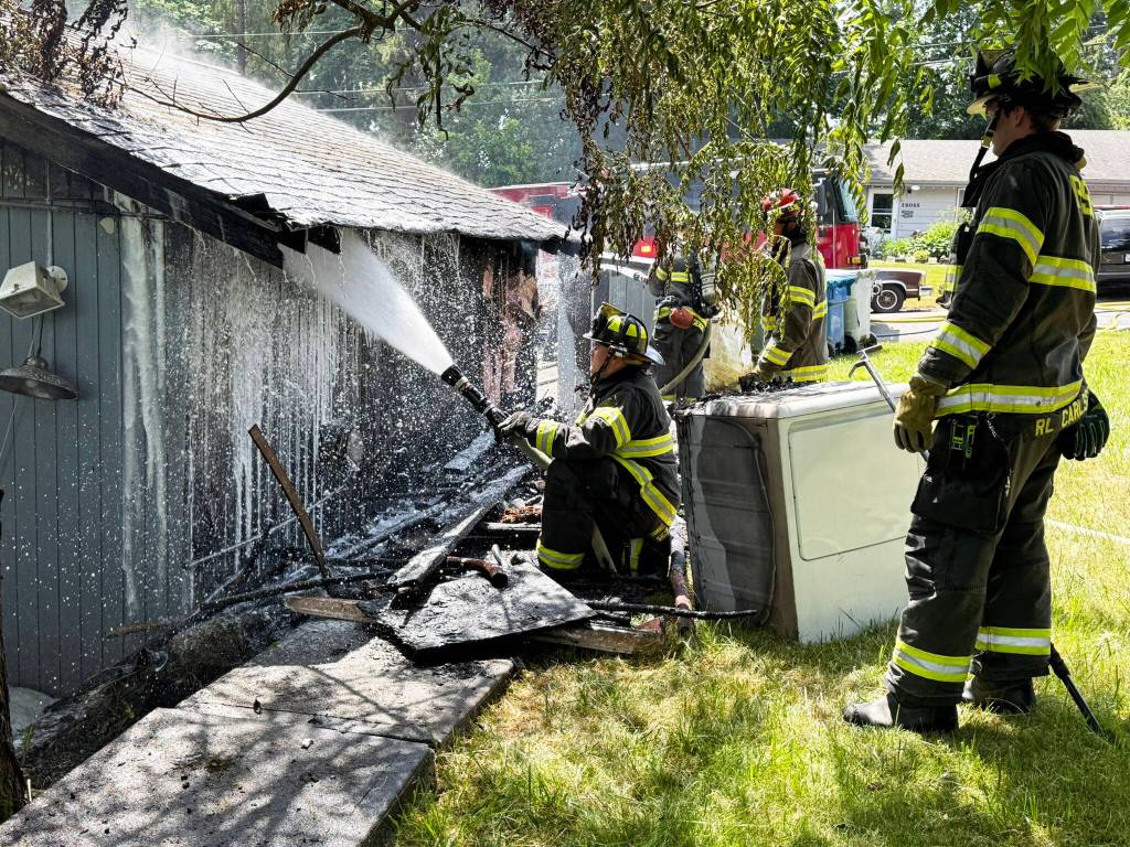 Puget Sound Fire firefighters fight a blaze June 11 at a residence in the 27200 block of 121st Avenue SE. COURTESY PHOTO, Puget Sound Fire