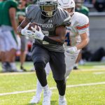 Kentwood football player chased during spring game against Auburn Mountainview. Photo provided by Robby Mullikin.