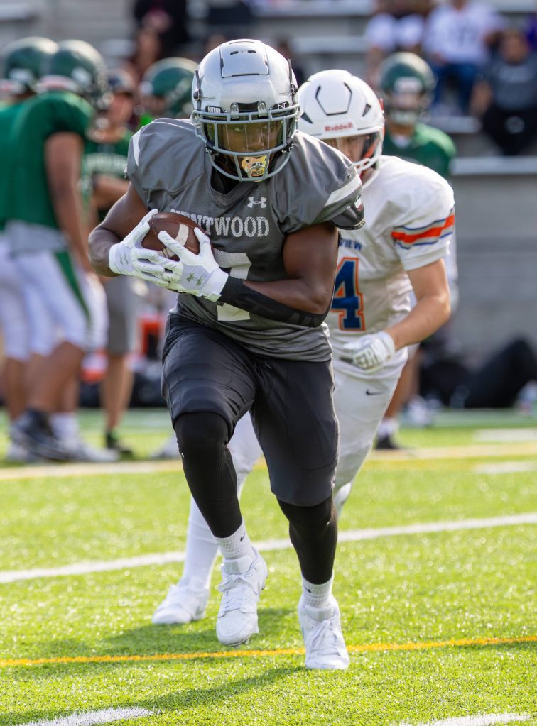 Kentwood football player chased during spring game against Auburn Mountainview. Photo provided by Robby Mullikin.