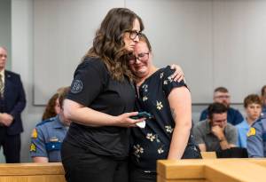 Washington State Patrol Trooper Christopher Gadd’s mother Gillian Gadd, left, comforts his wife Cammryn Gadd during the sentencing hearing at the Snohomish County Courthouse for Raul Benitez Santana on Wednesday, July 2, 2025 in Everett, Washington. (Olivia Vanni / The Herald)