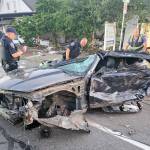 Kent Police officers examine damage to a car that smashed into a day care facility at 515 E. Smith St. COURTESY PHOTO, Puget Sound Fire