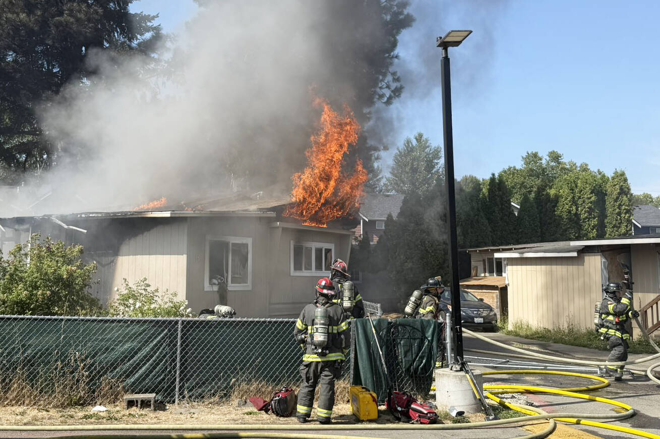 Firefighters battle a blaze July 21 at a residence in the 24400 block of 64th Avenue South in Kent. COURTESY PHOTO, Puget Sound Fire