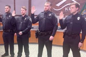 Kent Police Officer Conner Thompson, far right, during his swearing in ceremony in January. COURTESY PHOTO, City of Kent