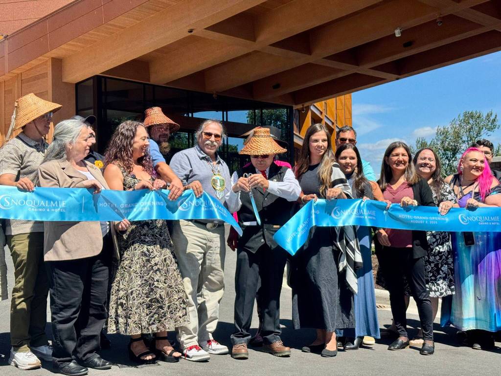 Photos by Grace Gorenflo/Valley Record
Robert de los Angeles, chairperson of the Snoqualmie Tribal Council, cuts the ribbon at the opening of the Snoqualmie Casinos hotel, surrounded by tribal members, Aug. 8, 2025.