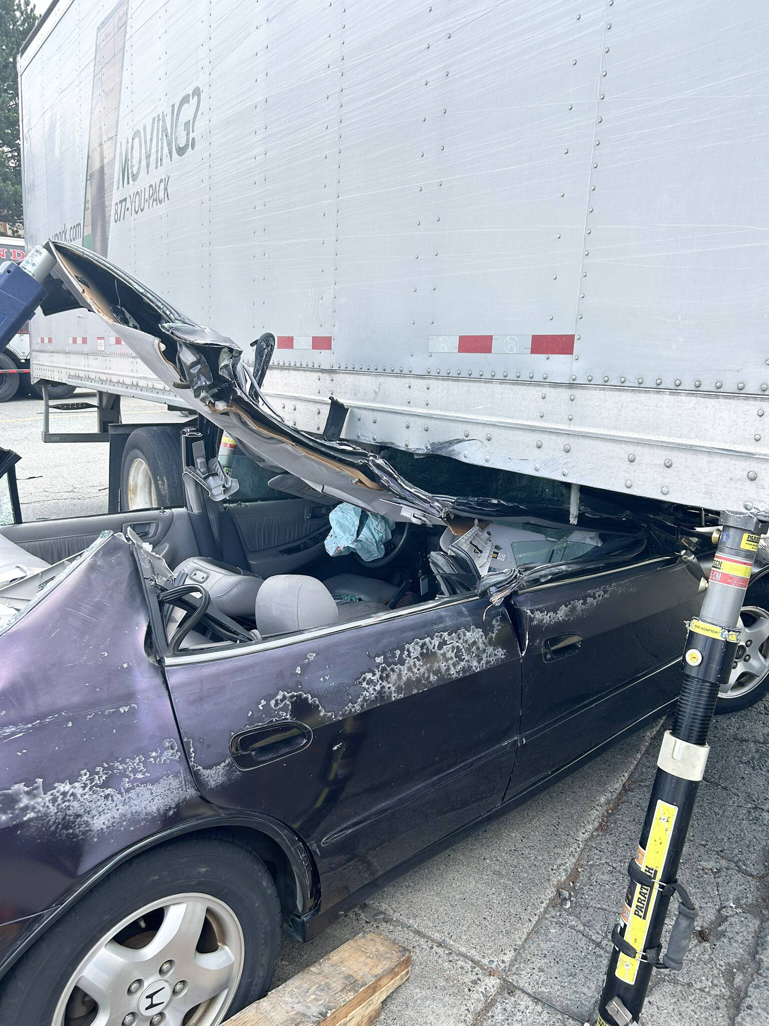 A vehicle ended up under a semi-trailer during an Aug. 18 crash along 83rd Avenue South in Kent. COURTESY PHOTO, Puget Sound Fire