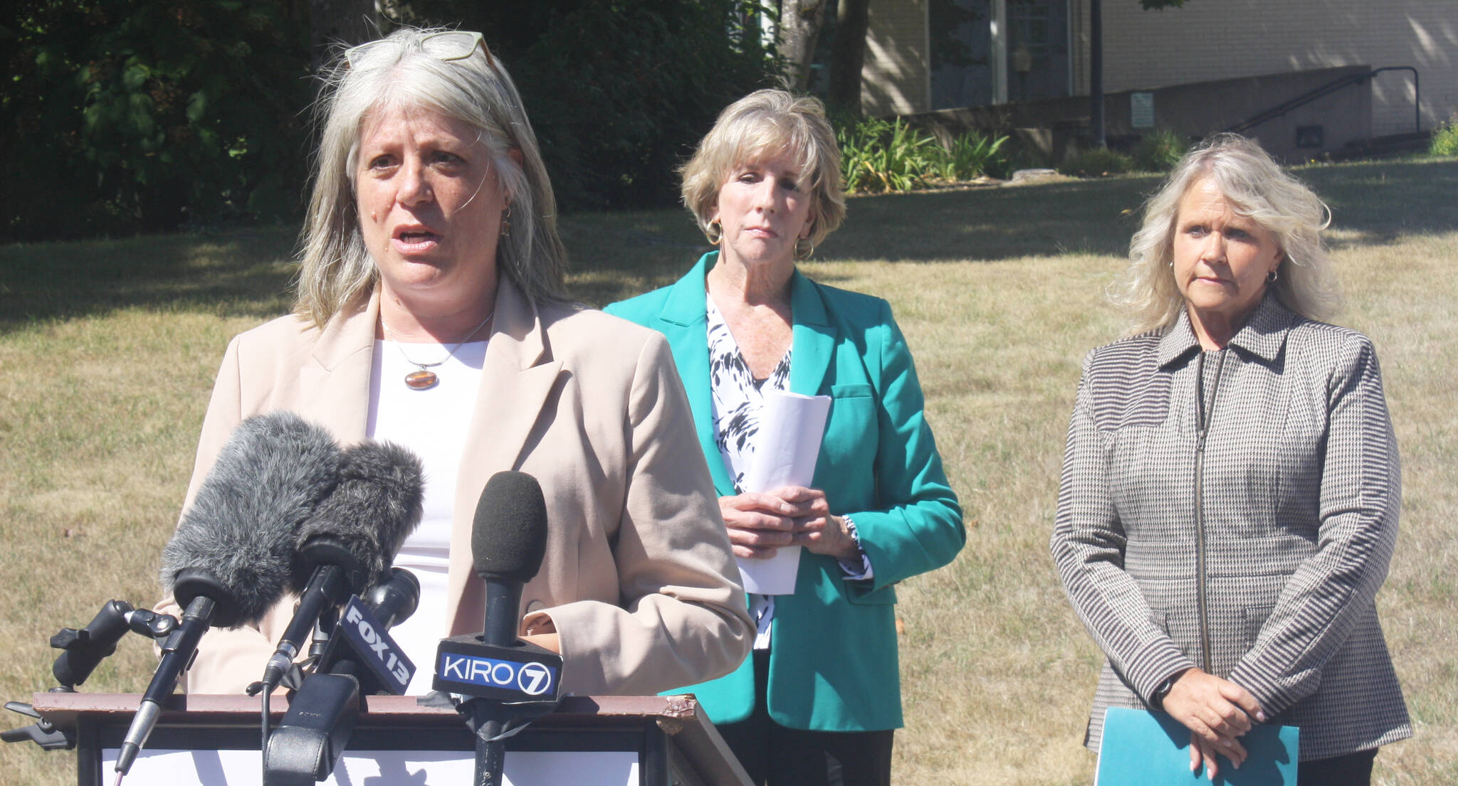 King County Councilmember Claudia Balducci speaks at a press conference Thursday, Aug. 21 in Kent about starting up a new retail crime task force as former King County Sheriff Sue Rahr, center, and Kent Mayor Dana Ralph look on. STEVE HUNTER, Kent Reporter