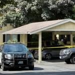Caution tape and officers at The Shores Apartments on Aug. 18. By Joshua Solorzano/The Mirror.